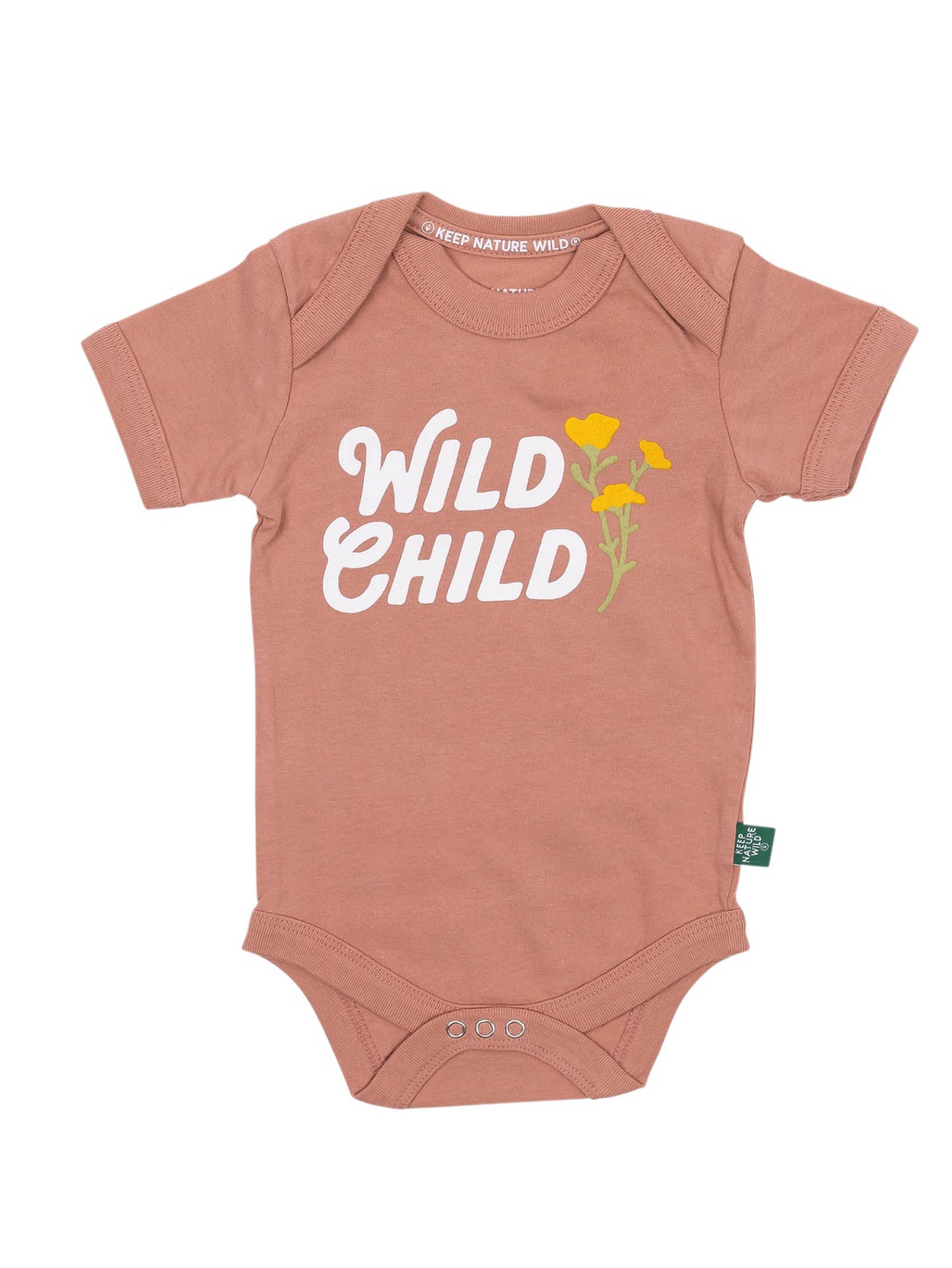 A dusty rose baby bodysuit with 'WILD CHILD' printed in white script across the chest, accented with yellow flowers and green stems. The bodysuit has short sleeves, three snap closures at the crotch, and a small green brand tag on the lower right side.