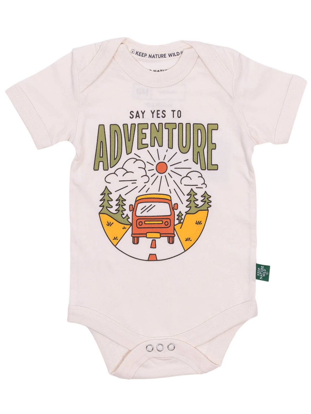 A baby short-sleeve bodysuit in a very light cream/off-white color, featuring a colorful graphic print on the front with the text 'SAY YES TO ADVENTURE' and an illustration of a red van, trees, hills, and a sun. The brand 'Keep Nature Wild!' is visible on the inner neck label and as a small tag on the side.