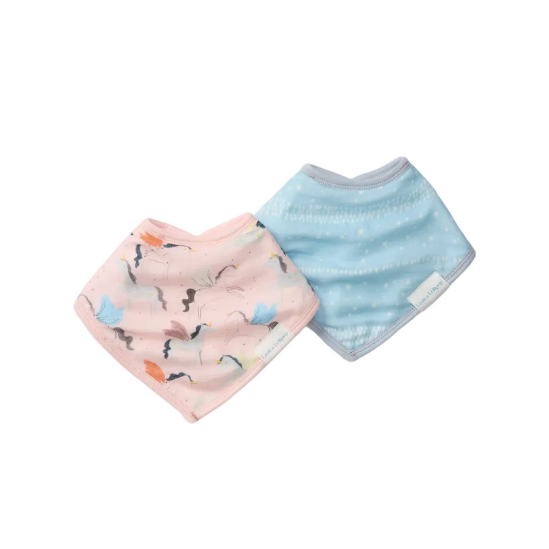 Two baby bibs, one pink with cat print and one blue with striped pattern, on a light gray background.