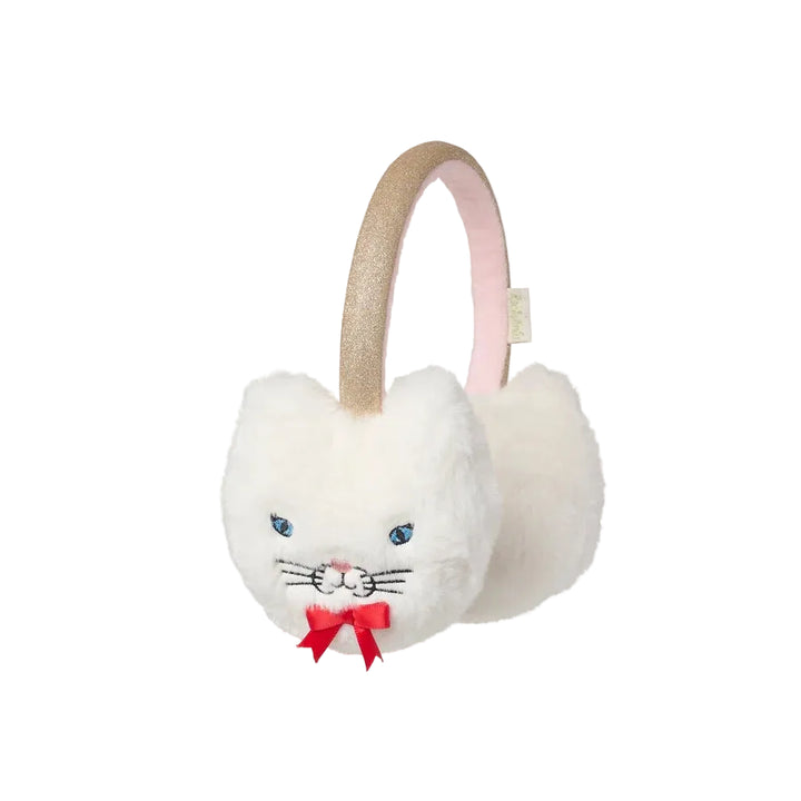 White plush cat-ear earmuffs with embroidered blue eyes, a red bow, and a glittery gold headband on a white background.