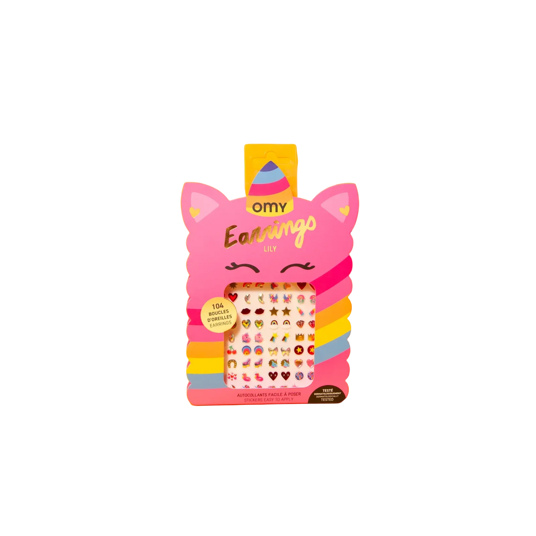 Omy Earning Lily sticker pack in a pink cat-ear shaped box, displayed on a bright yellow background. The packaging features gold foil lettering and a clear window showing the 104 colorful stickers inside.