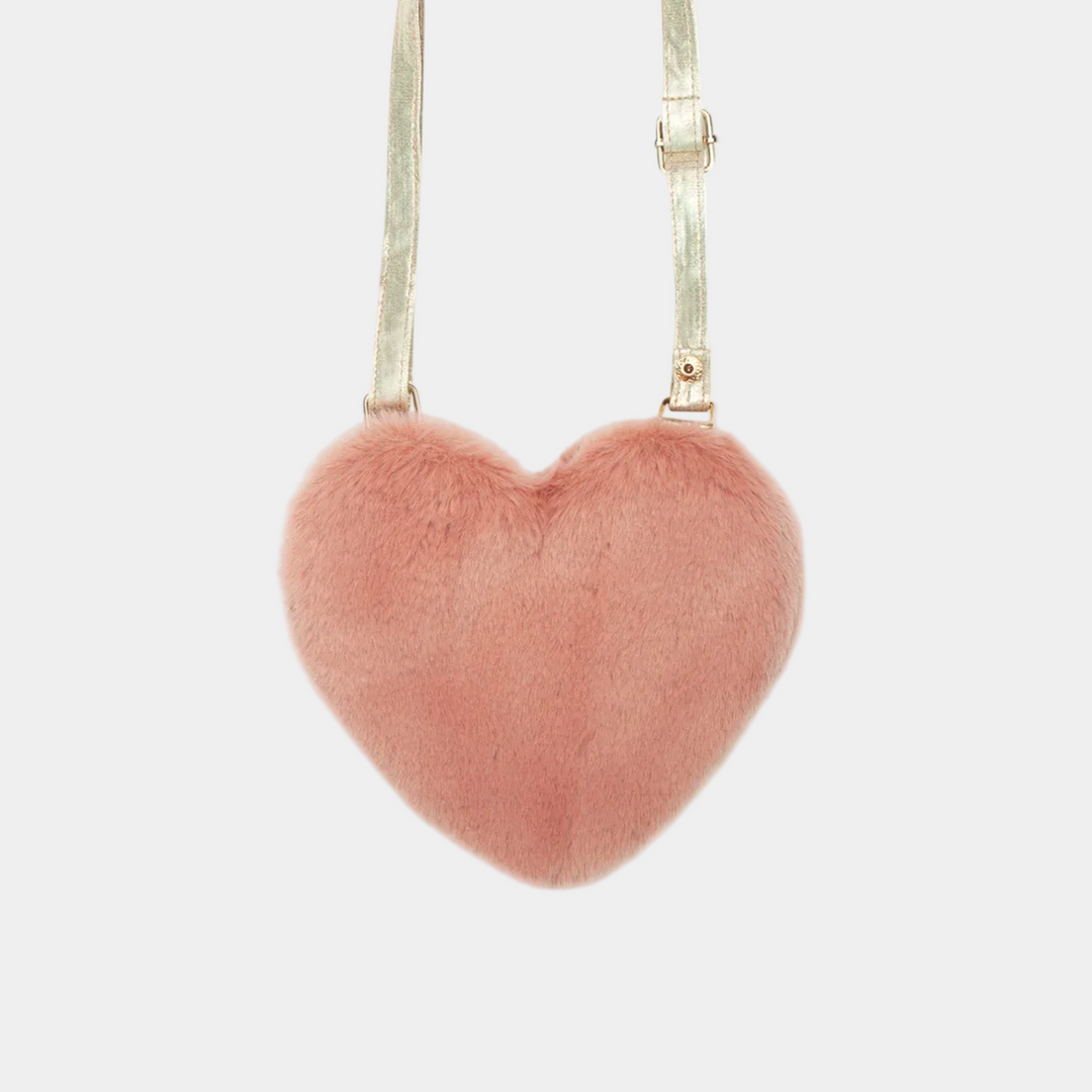 Heart-shaped pink fur bag on a white background