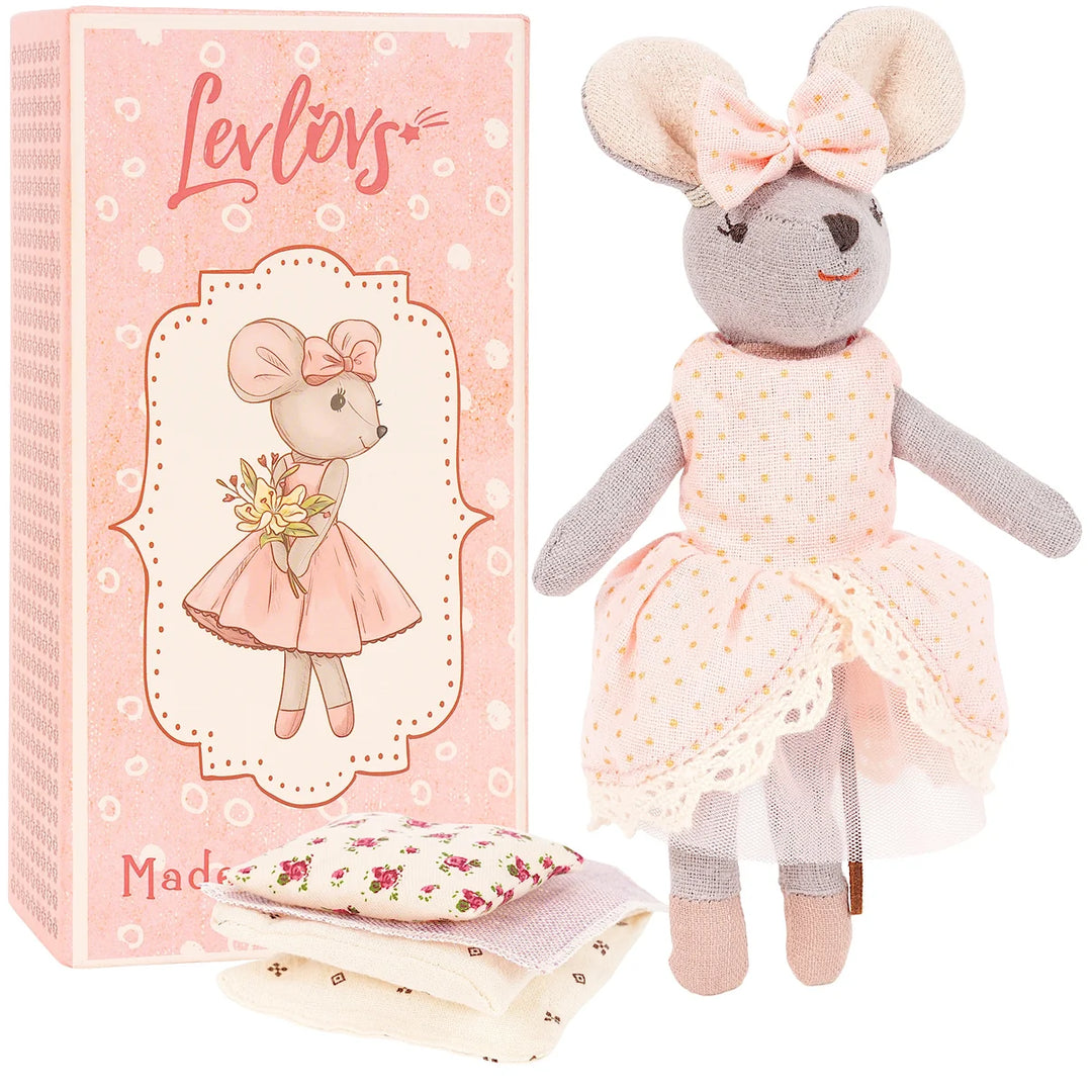 Plush mouse toy with a dress and bow, next to its packaging box.