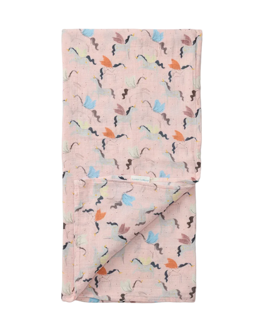 A folded light pink muslin blanket with a whimsical pattern of small flying bats and colorful leaves in orange, blue, green, and brown, shown on a neutral light gray background.