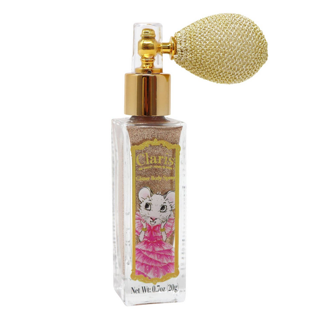 A clear rectangular spray bottle filled with glittery gold powder, featuring a gold pump and a large textured gold nose bulb. The front label shows a cartoon hamster in a pink dress and reads 'clary' with 'Hamster Glitter' below.